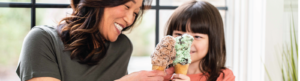 a mom and daughter enjoying two ice cream cones