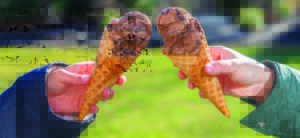 two cones of chocolate ice cream with denali chocolate variegate